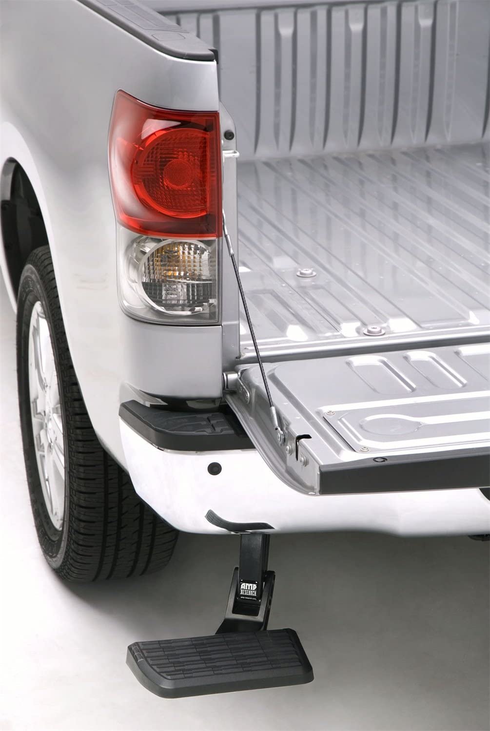 AMP Research 75305-01A BedStep Retractable Bumper Step for 2007-2013 Toyota Tundra Black, Large